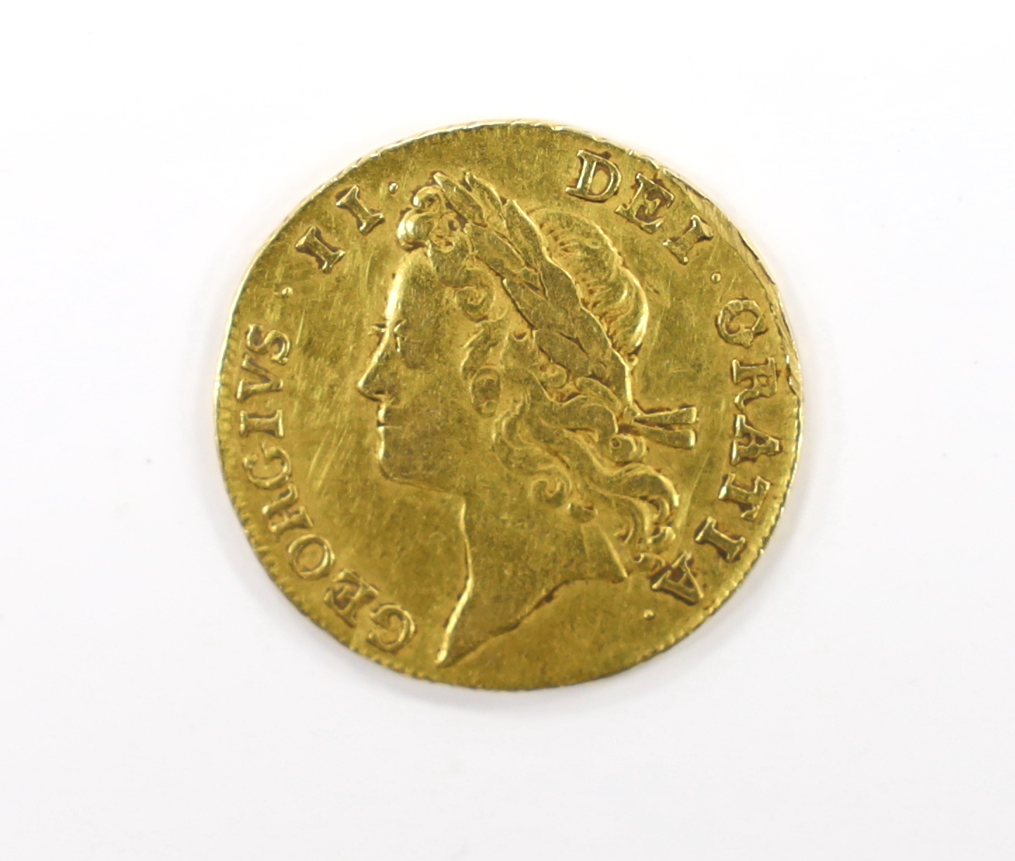 British gold coins, a George II gold guinea, 1733, second young laureate head (S3674), edge shaven at 2 o’clock otherwise fine or better